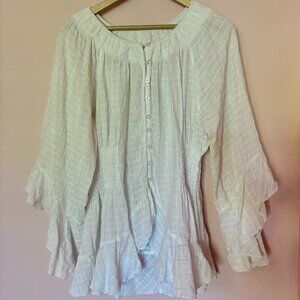 Flowy, white cotton blouse with bell sleeves